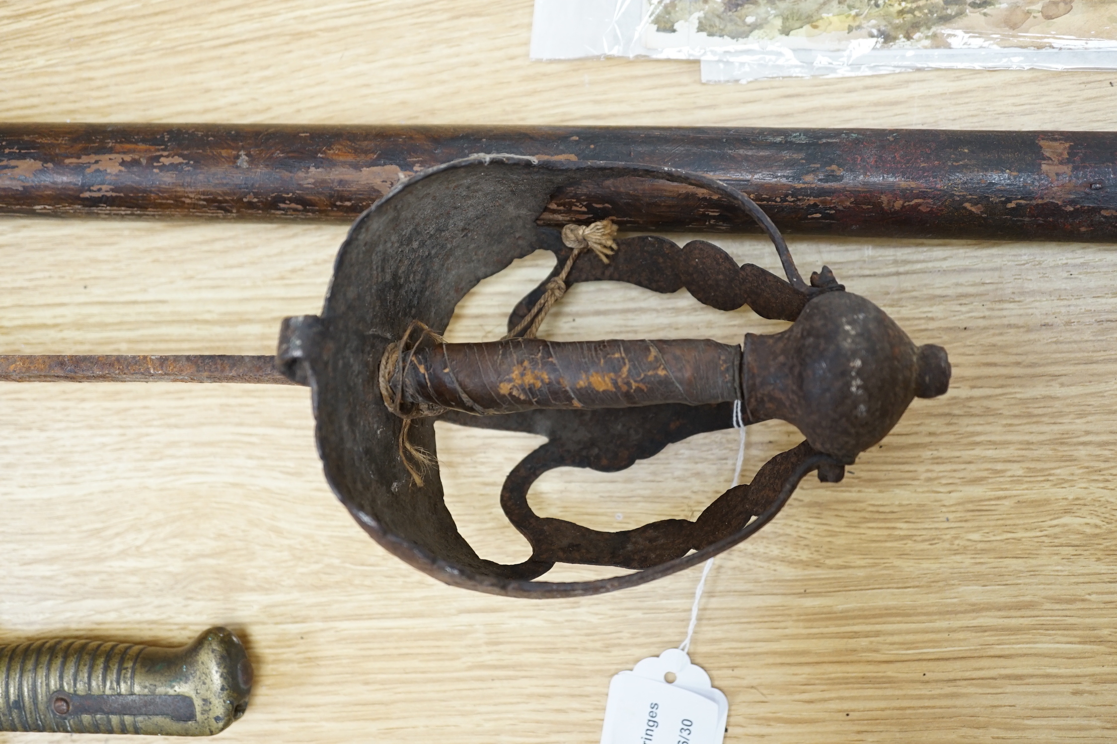 An early pike, a basket hilt sword and a French bayonet. longest 193cm